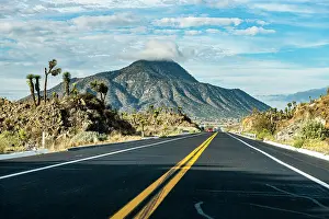 Leading: Road leading to El Pizarro volcano, Puebla, Mexico