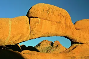 Ablaze: Rock arch - ablaze in late evening light framing