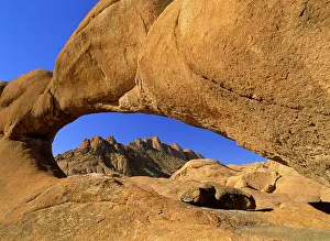 Curves: Rock arch - Pandock mountains seen through a rock