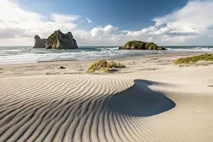 Patterned: Rock island on Wharariki beach, Wharariki Beach