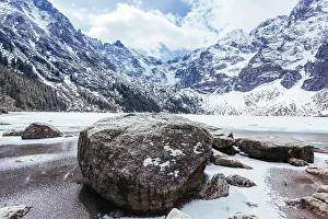 Quality: rocks lake with mountains winter. Resolution and