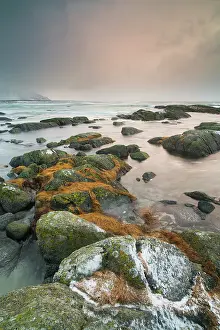 Laukvik: Rocks in the sea by sunset, Norway