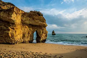 Praia: Rocky coast with beach and red rocks, Praia do Camilo