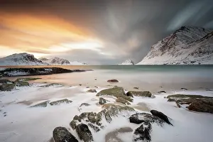 Haukland: Rocky coast with snow at sunset, Haukland, Lofoten