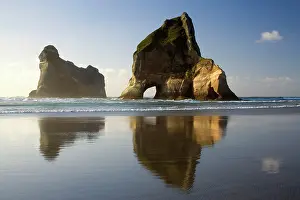 Wharariki: Rocky Islands - by powerful surf sculpted rock