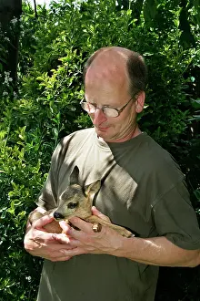 Handlers: Roe Deer - man holding fawn