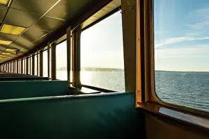 Ferry: Row of seats and window view of Puget Sound on the Spokane