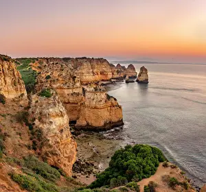 Erode: Rugged rocky coast with cliffs of sandstone, rock