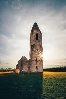 Decayed: Ruin of a church in a cornfield. Old catholic church