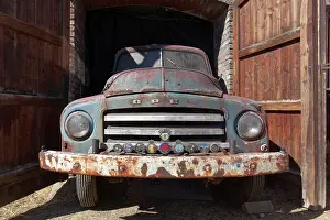 Opening: Rusted vintage Opel Blitz 1960, in opening of a