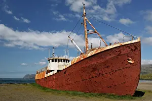 Shipwreck: Rusty boat run aground