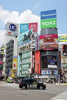 Transport: S Ride black taxi cab at Shibuya Scramble Crossing, Shibuya, Tokyo, Japan