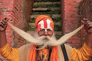 Monks: Sadhu Monk holding beard