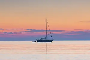 Sailing: Sailboat on the Baltic Sea in sunrise - Germany