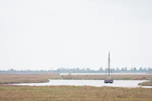 Lauwersmeer: Sailing boat sailing through a stream