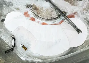 Lorry: Salt heaps with conveyor belt, lorry and excavator at the salt works of Walvis Bay Salt