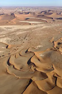 Camelthorn: Sand dunes in the Namib Desert- top centre the Witberg
