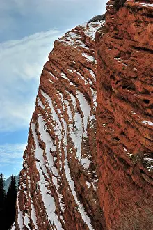 Ledge: Sandstone rockface covered with snow