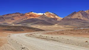 Roads: A sandy road winds its way through a vast