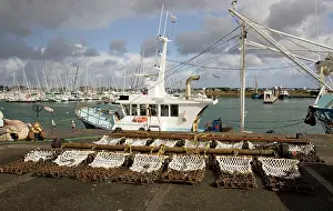 Trawlers: Scallop dredging nets with fishing trawlers
