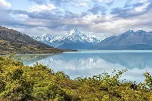 Glaciers: Scenic reflection of Mount Sefton and Mount Cook at lake Pukaki