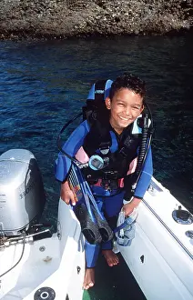 Aqua: Scuba diver boy in back of boat