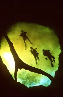 Divers: Scuba DIVER - three In freshwater cave