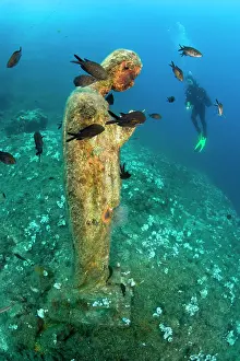 Mary: scuba diver and statue of Virgin Mary, Vervece rock, Marine