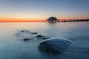 Pier: Seabridge with restaurant at sunrise - Timmendorfer