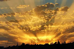 Sunrays: Seasonal weather: Beautiful sunset after a hot