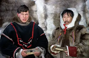 Planes: Selkup men in traditional clothes, holding traditional