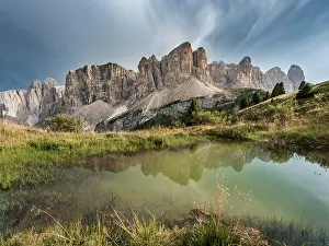 Sella: Sella Group with Piscadu reflected in a pond, Gardena