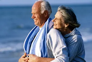 Senior: Senior couple walking on the beach