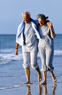 Senior: Senior couple walking on the beach