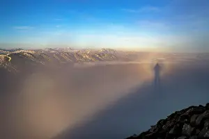 Caucasian: Shadow cast by the photographer in the fog, in the