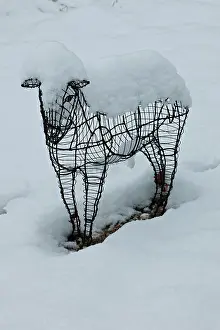 Metals: Sheep statue in a garden under snow