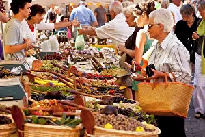 Shop: Shoppers buying fresh produce at the market