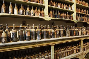 Shelf: Showroom with old dust covered sherry bottles at the B