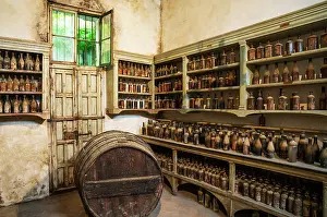 Shelf: Showroom with old dust covered sherry bottles at the B
