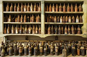 Shelf: Showroom with old dust covered sherry bottles at the B