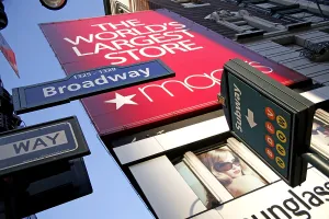 Signs: Sign for Macy's Department Store and a subway on Broadw