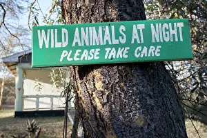 Elsamere: Sign: Wild Animals at night please take care -