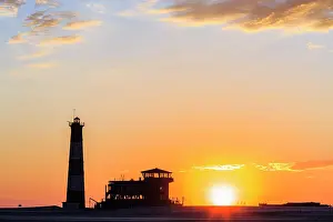 Lodge: Silhouettes, Lighthouse and Lodge at sunset, Pelican