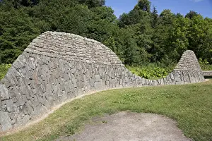 Feature: Sinuous stone wall sculpture representing local