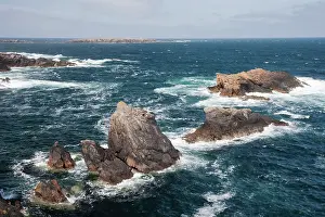 Holm: Skaw - rocky coastline with Holm of Skaw in background