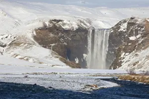 Falling: Skogafoss Waterfall (63m high) in winter