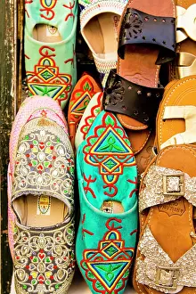 Shop: Slippers shoes in shops along narrow cobblestone streets of