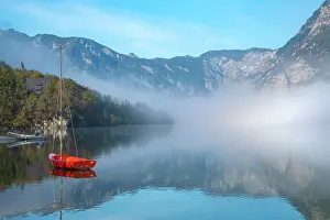 Slovenia: Slovenia, Lake Bohinj. Lake boats on foggy morning. ic Cathy
