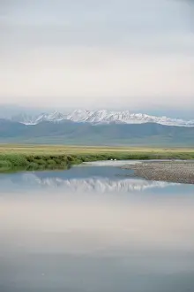 Anwr: Small Creek with reflection of snow covered mountains