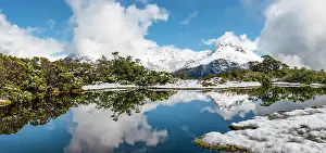 Southland: Small mountain lake with reflection, view of cloud-covered